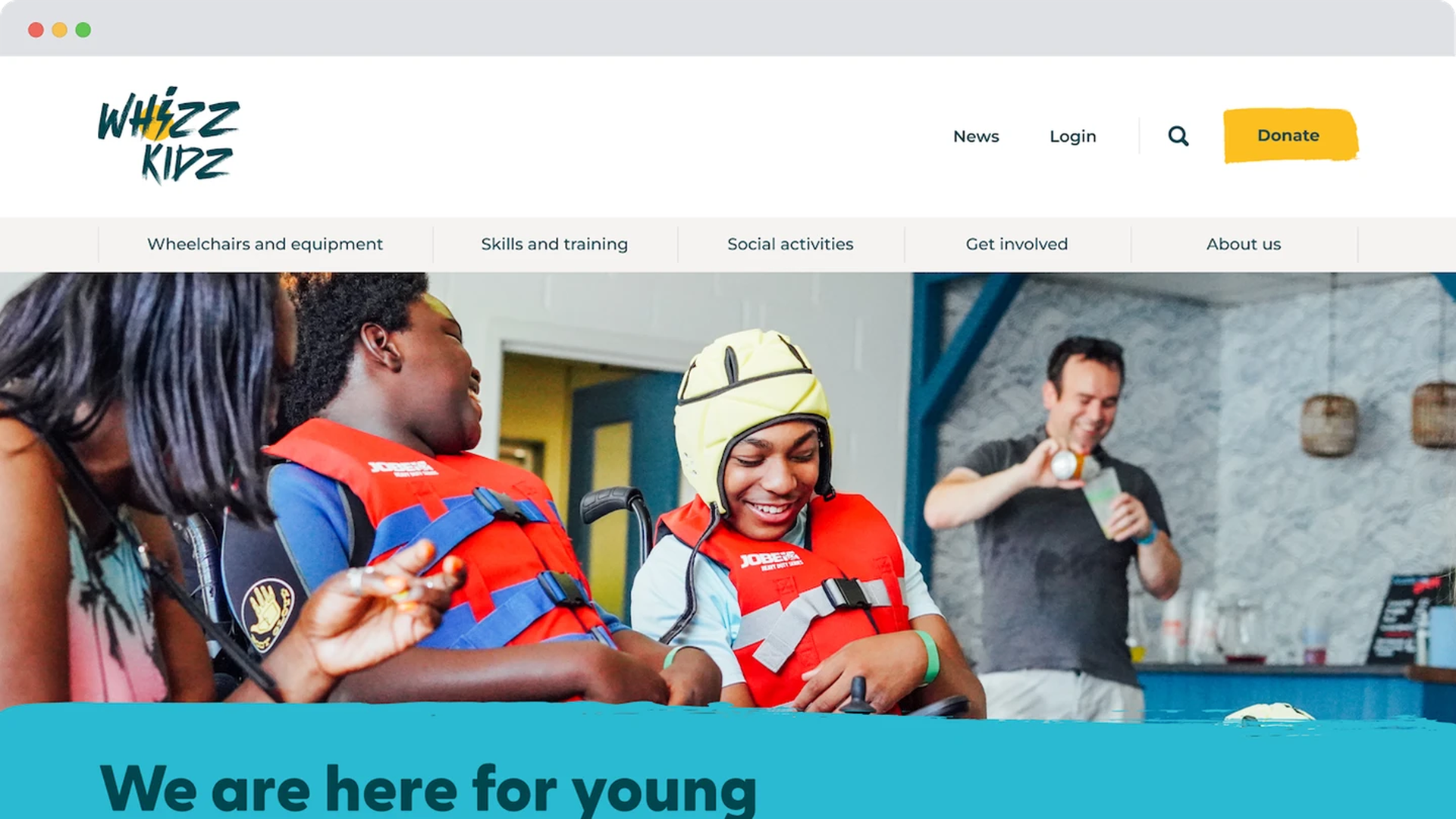 The refreshed Whizz-Kidz homepage displaying joyful children in life jackets using power chairs, smiling during an activity in a bright indoor setting.