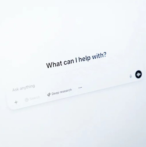 Close-up of a screen displaying the ChatGPT interface with the prompt "What can I help with?" and options for asking questions, representing AI-assisted search or support.
