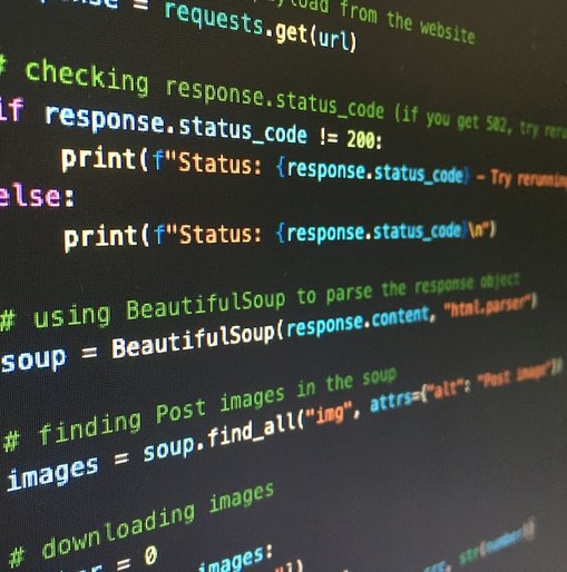 Close-up of a computer screen displaying Python code, including an if-else statement and use of the BeautifulSoup library for web scraping.